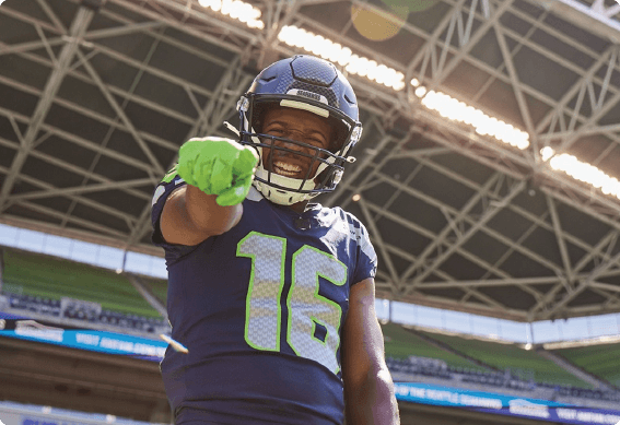 a person wearing a helmet and holding a green object in the hand