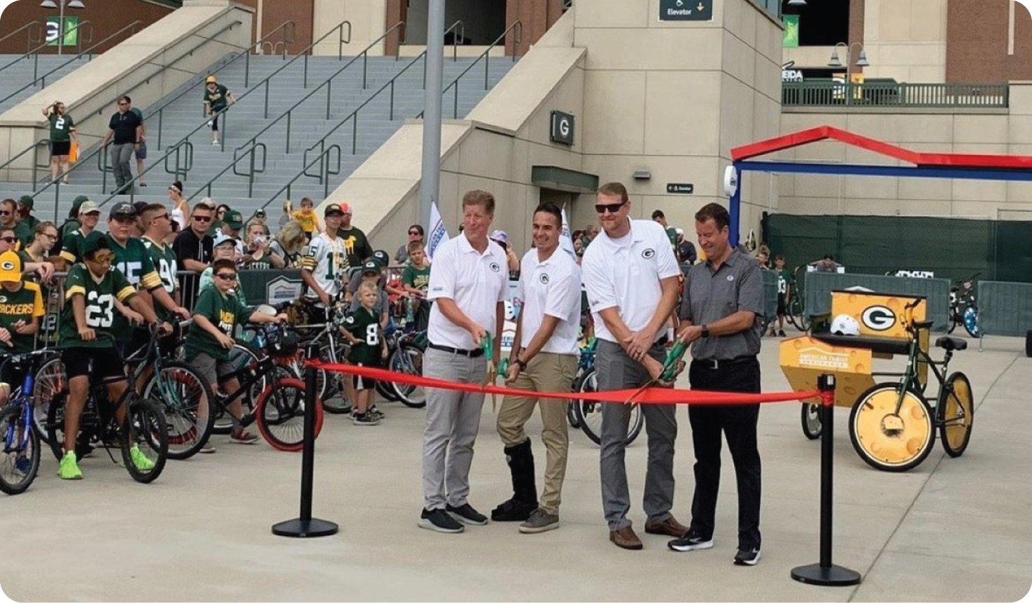 a group of people posing for a photo with bikes