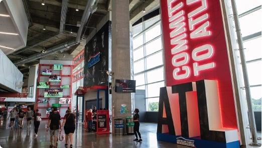 a large red sign in a mall