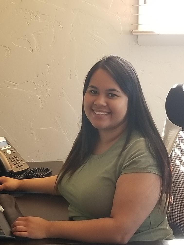 a woman sitting at a desk