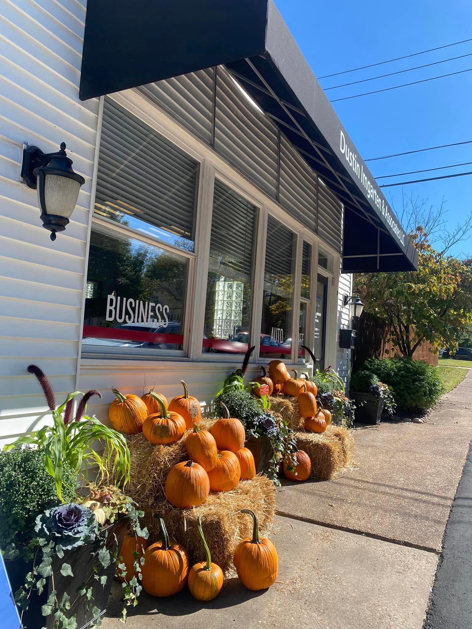 a group of pumpkins outside a house