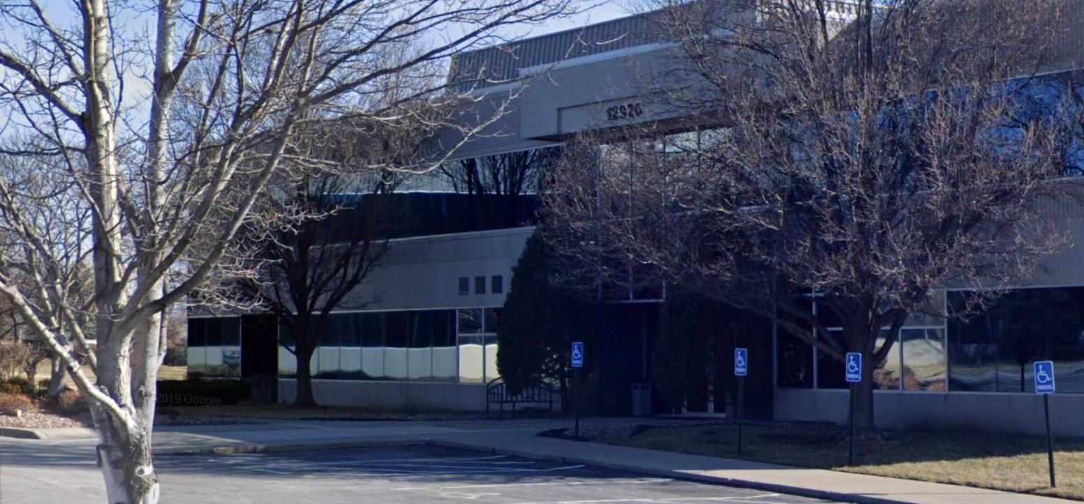 a building with trees in front of it