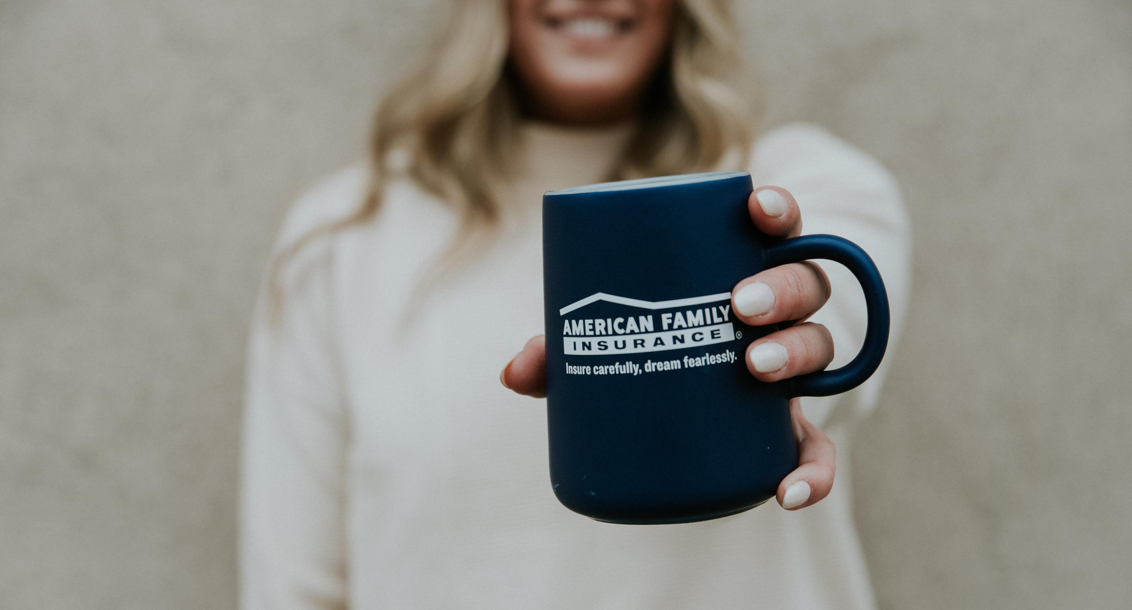 a person holding a coffee cup