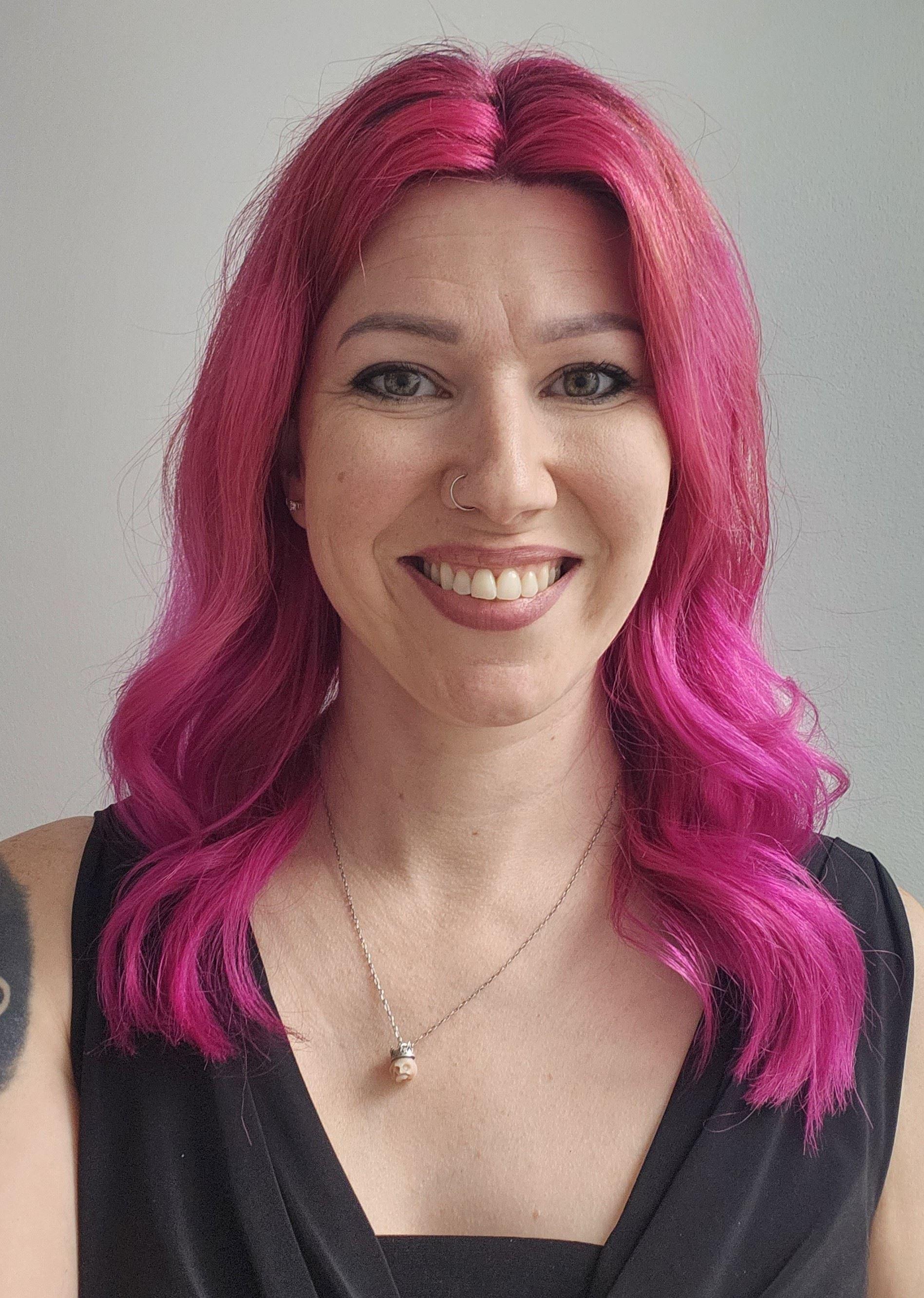 a woman with pink hair