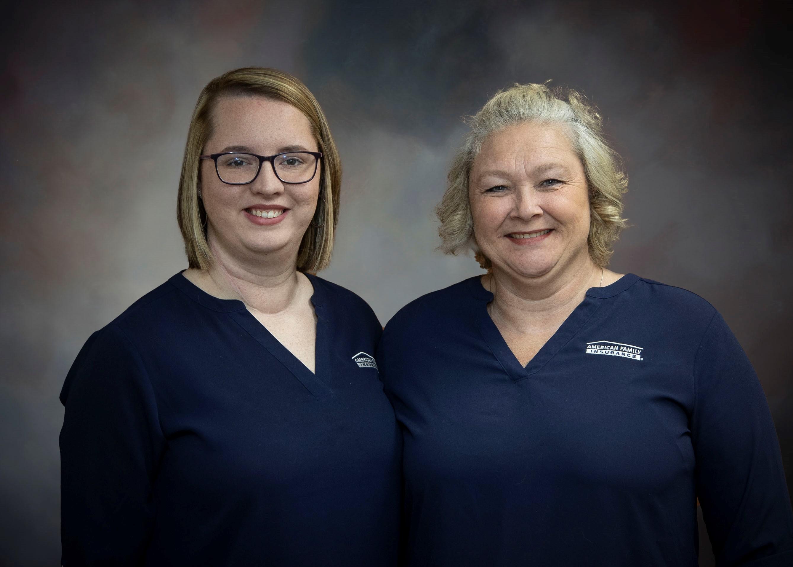 a couple of women in blue shirts