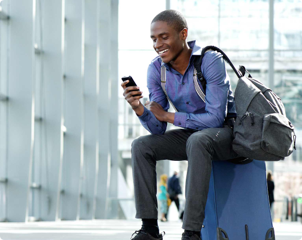 Young man looking at best budgeting app on his phone.