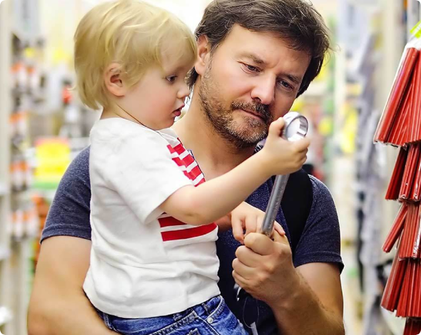 Man and child looking at tools