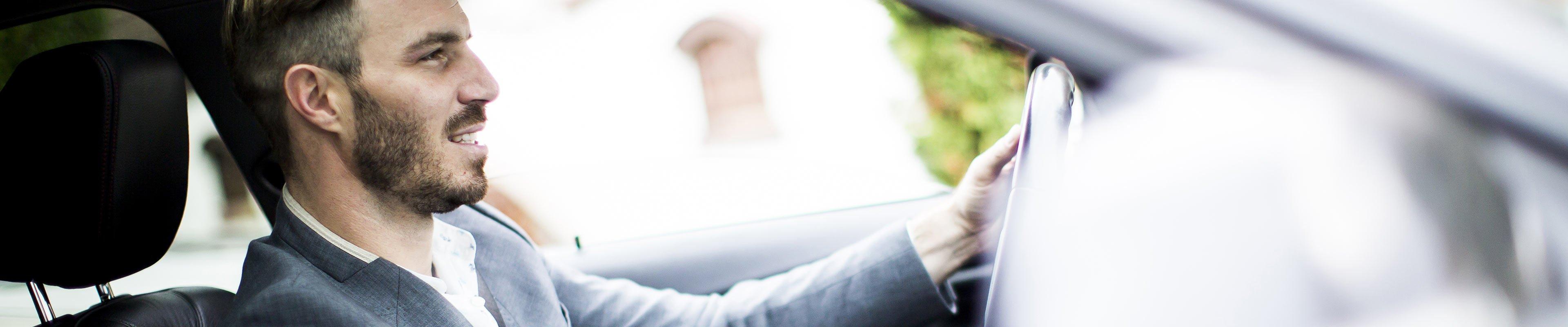 Image of a person driving a leased car.