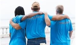 a group of people in blue shirts