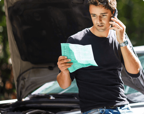 a man looking at an accident report