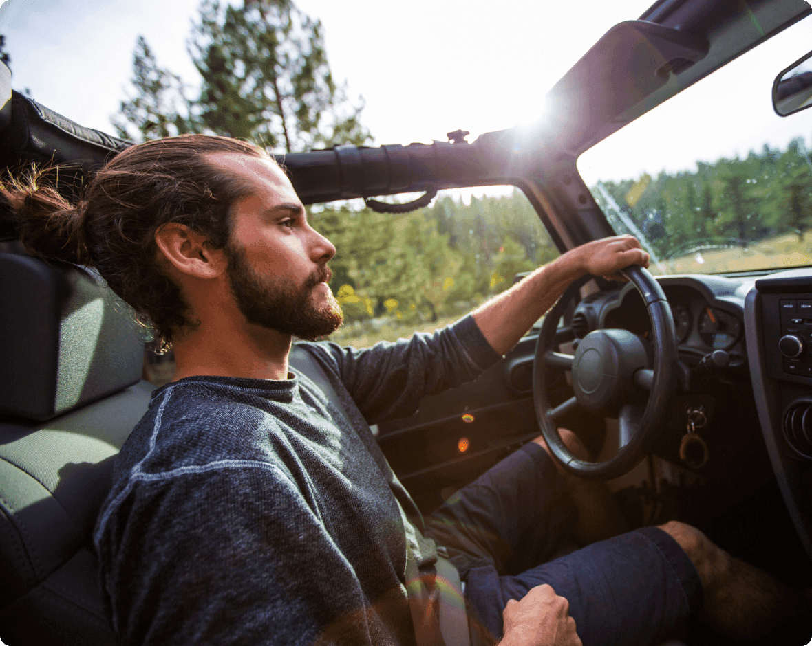 a man driving a car